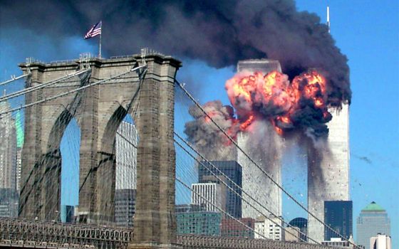 Both towers of the World Trade Center in New York City burn after being hit by planes Sept. 11, 2001. (CNS/Reuters/Sara K. Schwittek)
