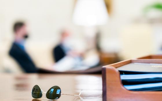 President Biden's sunglasses are seen on the Resolute Desk during an April 11 infrastructure meeting with White House staff in the Oval Office of the White House. (Official White House photo/Cameron Smith)
