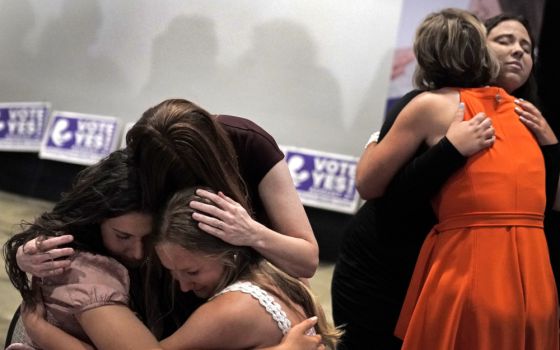 People hug during a "Value Them Both" watch party after a question involving a constitutional amendment removing abortion protections from the Kansas constitution failed Aug. 2 in Overland Park, Kansas. (AP/Charlie Riedel)