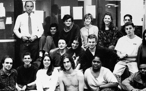 Jesuit Fr. Raymond A. Schroth, top left, poses with staff of The Maroon, the student newspaper of Loyola University New Orleans, for a yearbook photo in 1994. (The Wolf yearbook archives)