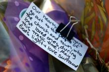 A note is seen at a memorial Nov. 7 near the site of the Nov. 5 shooting at the First Baptist Church of Sutherland Springs, Texas. (CNS/Reuters/Jonathan Bachman)