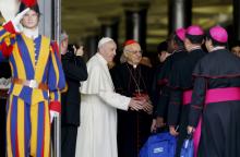 Pope Francis greets bishops as they arrive for a session of the Synod of Bishops on young people, the faith and vocational discernment at the Vatican Oct. 16. (CNS/Paul Haring)