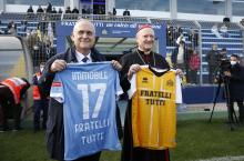 Claudio Lotito, president of the Lazio professional soccer club, and Cardinal Gianfranco Ravasi, president of the Pontifical Council for Culture, hold shirts for their respective teams before a friendly match between the Vatican's "Fratelli Tutti" squad a