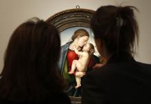 Women view "The Madonna and Child" by Fra Bartolommeo as it hangs in Christie's gallery Jan. 29, 2013, in New York. (CNS/Reuters/Mike Segar)