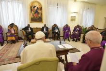 Pope Francis is seated next to Anglican Archbishop Justin Welby of Canterbury, England, spiritual leader of the Anglican Communion, during a meeting at the end of a two-day spiritual retreat with South Sudanese leaders at the Vatican in this April 11, 2019, file photo. The pope plans to visit South Sudan July 5-7. (CNS photo/Vatican Media via Reuters)