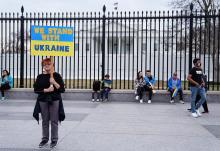A woman near the White House in Washington holds a sign during a March 6 protest against Russia's invasion of Ukraine. (CNS/Reuters/Sarah Silbiger)