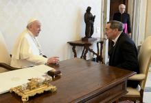Pope Francis talks with Joe Donnelly, new U.S. ambassador to the Holy See, during a meeting for the ambassador to present his letters of credential, April 11 at the Vatican. (CNS/Vatican Media)