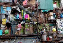 Residents are pictured outside their homes May 4, 2020, in a poor section of Manila, Philippines. (CNS/Reuters/Eloisa Lopez)