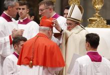 Pope Francis places a red biretta on new U.S. Cardinal Kevin Farrell during a consistory in St. Peter's Basilica at the Vatican in this Nov. 19, 2016, file photo. (CNS/Paul Haring)