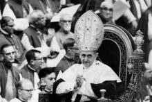 Pope Paul VI makes his way past bishops during a session of the Second Vatican Council in 1964. 