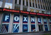 A headline about then-President Donald Trump is displayed outside Fox News studios in New York on Nov. 28, 2018. Documents in a defamation lawsuit illustrate pressures faced by Fox News journalists in the weeks after the 2020 presidential election. The network was on a collision course between giving its conservative audience what it wanted and reporting uncomfortable truths about then-President Donald Trump and his false fraud claims. (AP Photo/Mark Lennihan, File)