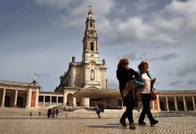 Women walk at the Marian shrine of Fátima in central Portugal March 30. (OSV News/Reuters/Pedro Nunes)