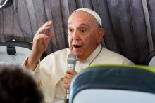 Pope Francis answers questions from journalists aboard his flight back to Rome from Lisbon, Portugal, Aug. 6, 2023, after his participation in World Youth Day. 