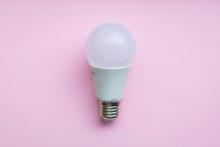 White light bulb on pink background (Unsplash/Michał Turkiewicz)