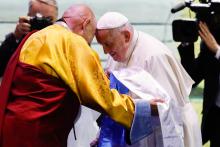 Pope Francis receives a scarf as a gift from Choijiljav Dambajav, abbot of the Buddhists' Zuun Khuree Dashichoiling Monastery in Ulaanbaatar, Mongolia, during an ecumenical and interreligious meeting at the city's Hun Theatre Sept. 3, 2023. (CNS photo/Lola Gomez)