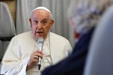 Pope Francis answers questions from journalists aboard his flight back to Rome from Ulaanbaatar, Mongolia, Sept. 4, 2023, after a four-day visit to the Asian country. (CNS photo/Lola Gomez)