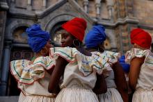 Members of a Haitian dance group in Boston wait to perform outside the Basilica and Shrine of Our Lady of Perpetual Help Oct. 16, 2021. (CNS/Reuters/Shannon Stapleton)