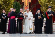Pope Francis and other Christian leaders give their blessing at the end of an ecumenical prayer vigil in St. Peter's Square Sept. 30, ahead of the Synod of Bishops assembly: from left, are the Rev. Ann Burghardt, general secretary of the Lutheran World Federation; Anglican Archbishop Justin Welby of Canterbury; Francis; Orthodox Ecumenical Patriarch Bartholomew of Constantinople and Syriac Orthodox Patriarch Ignatius Aphrem II. (CNS/Lola Gomez)