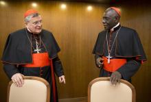 Cardinal Raymond Leo Burke, left, talks with Cardinal Robert Sarah in Rome, Oct. 14, 2015. (AP/Andrew Medichini, File)