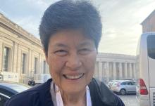 Mercy Sister Angela Perez, of Guam, poses for a photo Oct. 6 outside Paul VI Hall before the start of the third day of the Synod of Bishops in Vatican City. Seeing the pope at a roundtable, like other participants, gives her the sensation that she's witnessing the "dismantling of the hierarchical," she told Global Sisters Report. (GSR photo/Rhina Guidos)