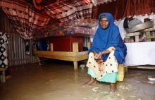 Fatima Abdi, 50, a Somali woman, sits inside her flooded makeshift shelter following heavy rains at the Al Hidaya camp for the internally displaced people on the outskirts of Mogadishu, Somalia, Nov. 6, 2023. (OSV News/Reuters/Feisal Omar)