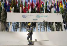 A worker sets up at the COP28 U.N. climate summit Nov. 30 in Dubai, United Arab Emirates. (AP/Rafiq Maqbool)