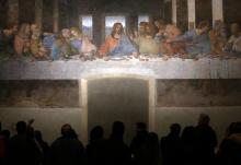 Visitors are pictured in a file photo looking at Leonardo da Vinci's "The Last Supper" on a refectory wall at Santa Maria delle Grazie Church in Milan. (OSV News/Reuters/Stefano Rellandini)