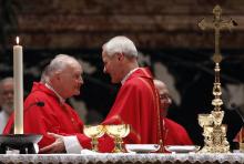 Cardinal Donald Wuerl of Washington, D.C., right, greets then-Cardinal Theodore McCarrick, retired archbishop of Washington, during the sign of peace at a Mass of thanksgiving in St. Peter's Basilica at the Vatican Nov. 22, 2010. (CNS/Paul Haring) 