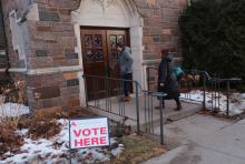 People enter Nativity of Our Lord Church in St. Paul, Minnesota, March 3, when the church served as a polling place for the Super Tuesday presidential primary. (CNS/Catholic Spirit/Dave Hrbacek)