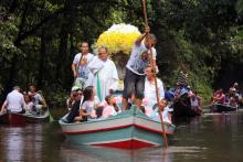 Pilgrims travel in boats as they accompany the statue of Our Lady of Nazareth during an annual river procession and pilgrimage along the Apeu River to a chapel in Macapazinho, Brazil, Aug. 3, 2014. (CNS/Reuters/Ney Marcondes)