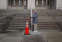 An elderly man in White Plains, New York, waits in line to receive a COVID-19 vaccine Feb. 23, 2021. (CNS/Reuters/Mike Segar)