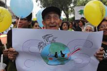 A man participates in an interfaith vigil before the 2014 U.N. climate summit in Lima, Peru. (Barbara Fraser)
