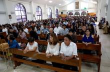 Catholics on the island of Guam pray during Mass at Santa Barbara Church in 2017. (CNS/Reuters/Erik De Castro)