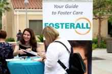 Noemi Amezcua, left, works to recruit potential foster families for FosterAll outside St. Elizabeth Ann Seton Church, a parish within the Los Angeles Archdiocese, on Father’s Day, June 16. (RNS/Heather Adams)