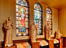 Statuary and stained-glass windows at St. Stanislaus Kostka Church in Pittsburgh: An evening Mass on the first Friday of every month has been attracting young people to the church. (Wikimedia Commons/Bestbudbrian)