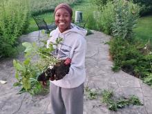 Ylanda Wilhite, photographed by her mother, Lisa, holding home grown potatoes in the back yard. (Courtesy of Lisa Wilhite)