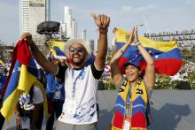 Young people cheer as they wait for Pope Francis' arrival at a welcoming ceremony and gathering with young people at Santa María la Antigua Field in Panama City Jan. 24. (CNS/Paul Haring)