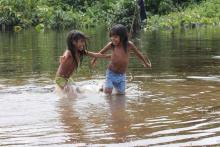 Two Urarina Indigenous girls play in the Urituyacu River in northeastern Peru. (Photo/Barbara Fraser)