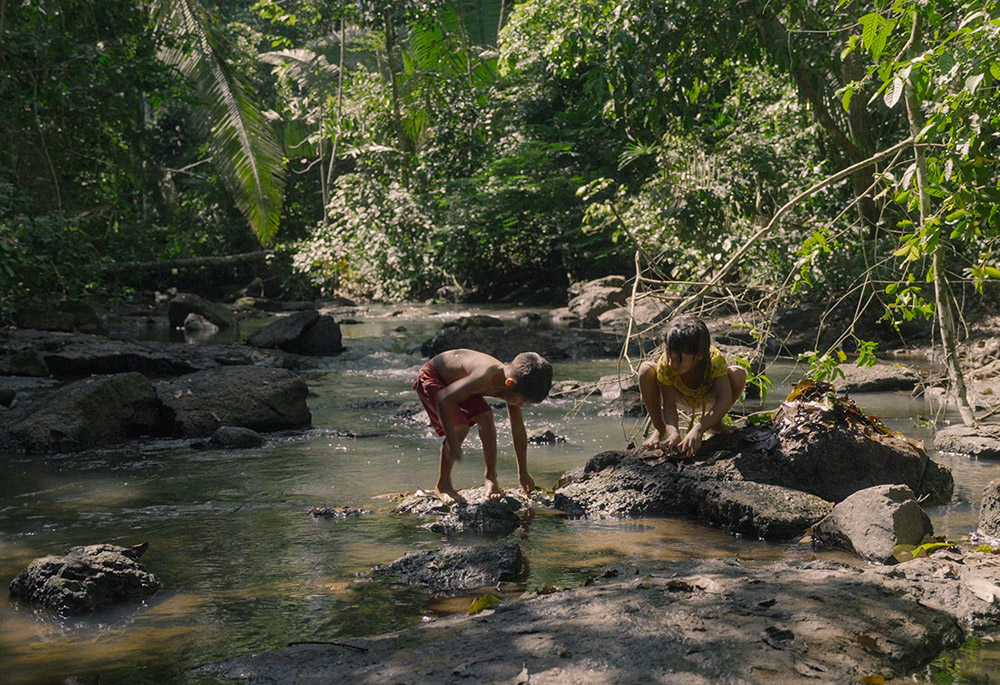 Uru-eu-wau-wau children play in a stream next to their village. (Films.NationalGeographic.com/Amazon Land Documentary/Alex Pritz)