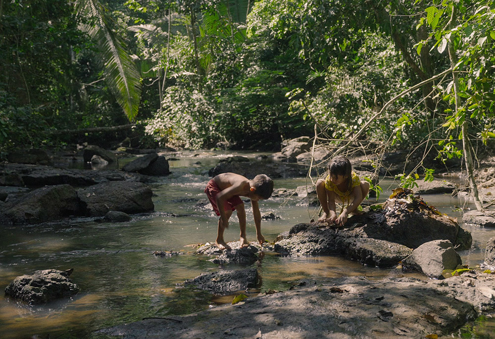 Uru-eu-wau-wau children play in a stream next to their village. (Films.NationalGeographic.com/Amazon Land Documentary/Alex Pritz) Uru-eu-wau-wau children play in a stream next to their village. (Films.NationalGeographic.com/Amazon Land Documentary/Alex Pritz)