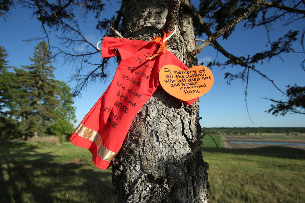 An offering is seen at the site of the former Brandon Indian Residential School June 12, 2021. Researchers — partnered with the Sioux Valley Dakota Nation — located 104 potential graves at the site in Brandon, Manitoba. (CNS/Reuters/Shannon VanRaes)