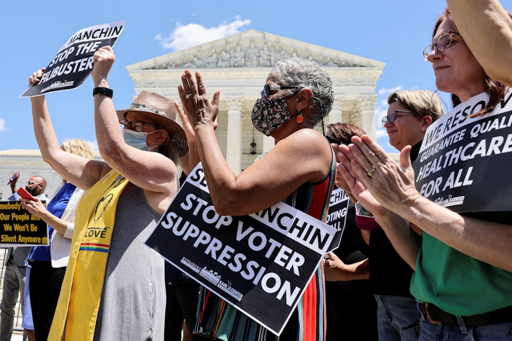 Demonstrators in Washington rally in support of voting rights legislation June 23. (CNS/Reuters/Evelyn Hockstein)