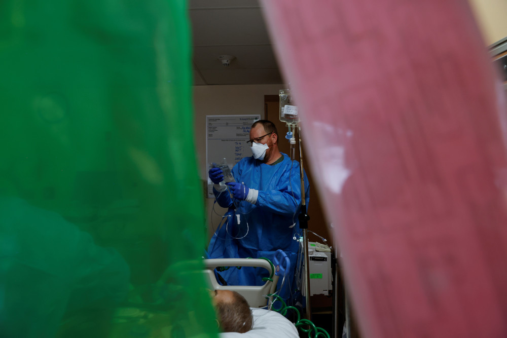 A nurse in the intensive care unit at St. Mary Medical Center in Apple Valley, California, treats a COVID-19 patient Feb. 1. (CNS/Reuters/Shannon Stapleton)