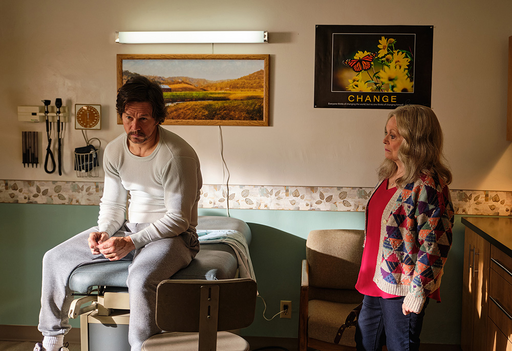 Stuart Long (Mark Wahlberg), left, with his mother Kathleen Long (Jacki Weaver) in Columbia Pictures' "Father Stu" (Courtesy of Sony Pictures) Stuart Long (Mark Wahlberg), left, with his mother Kathleen Long (Jacki Weaver) in Columbia Pictures' "Father Stu" (Courtesy of Sony Pictures)