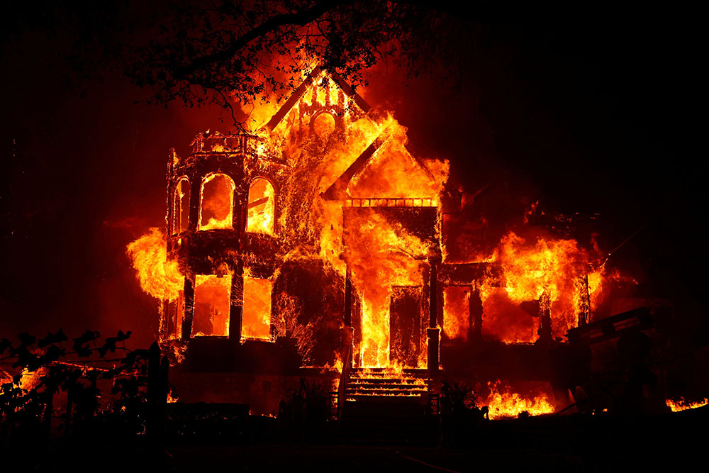 A home is seen fully engulfed in flames during the Glass Fire in St. Helena, California, Sept. 27, 2020. (CNS/Reuters/Stephen Lam) A home is seen fully engulfed in flames during the Glass Fire in St. Helena, California, Sept. 27, 2020. (CNS/Reuters/Stephen Lam)