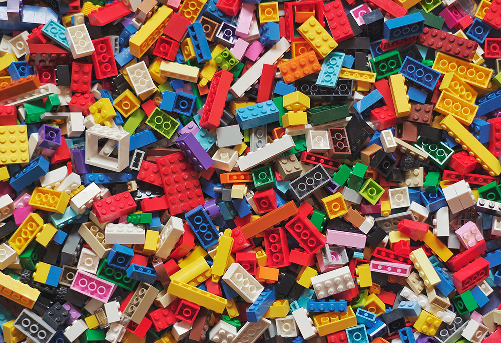 Random Lego pieces (Unsplash/Xavi Cabrera)
