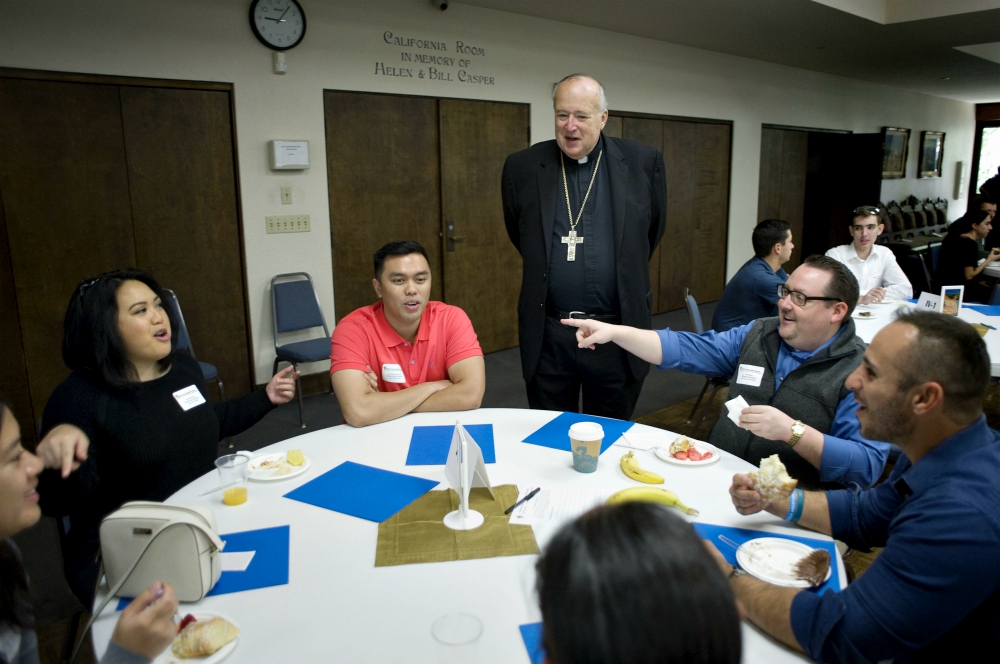 Bishop Robert McElroy joins a table discussing one of the 31 proposals during the Young Adult Synod in San Diego. (David Maung) Bishop Robert McElroy joins a table discussing one of the 31 proposals during the Young Adult Synod in San Diego. (David Maung)